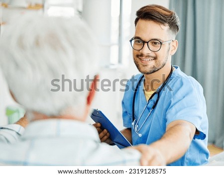Portrait  of a senior man with doctor or nurse caregiver at home or nursing home