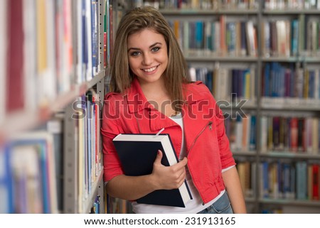 A Portrait Of An Caucasian College Student Girl In Library - Shallow Depth Of Field