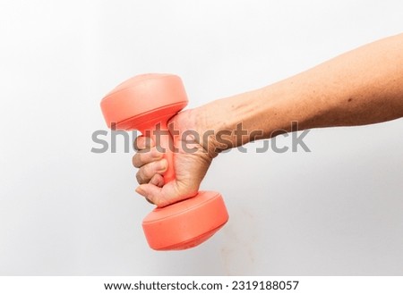 A Red Dumbbell in a Hand