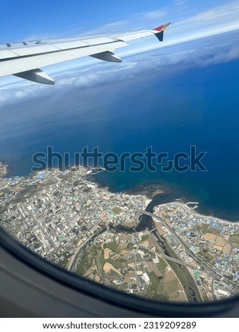 A picture outside the window of airplane after some minutes after take off.