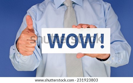WOW ! - Businessman with card and thumbs up Royalty-Free Stock Photo #231923803