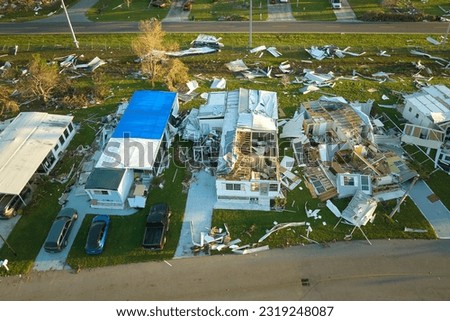 Destroyed by hurricane Ian suburban houses in Florida mobile home residential area. Consequences of natural disaster Royalty-Free Stock Photo #2319248087