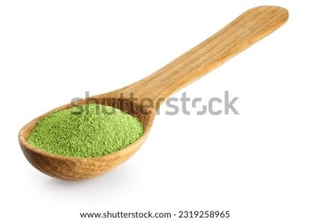 Wooden spoon with powdered matcha green tea isolated on white background. With clipping path.