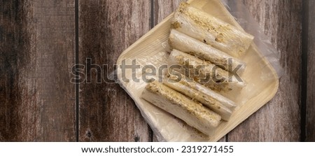 South India - Andhra Pradesh Home made traditional sugary  food Pootharekulu on a rustic wooden background selective focus. Royalty-Free Stock Photo #2319271455