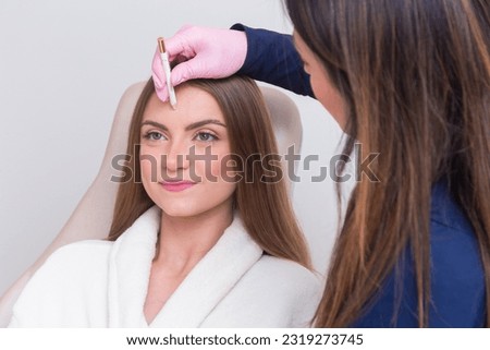 Woman wearing bathrobe in beauty clinic, aesthetics, patient, cosmetic procedures. application. anti wrinkle and anti aging. Royalty-Free Stock Photo #2319273745