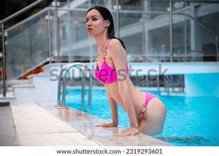 Fit slender woman at the pool