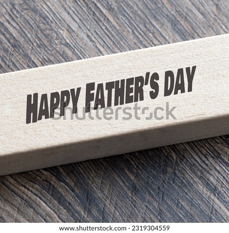 Happy fathers day sign on wooden boards background.