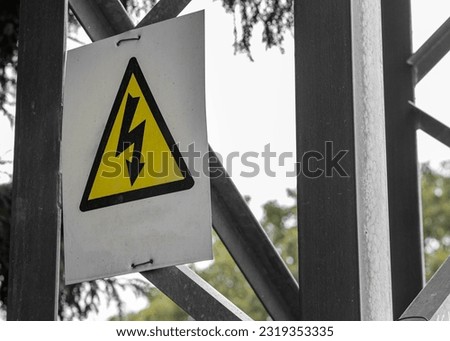 Generic High Voltage Danger Sign,symbol. Black arrow isolated in yellow triangle. Warning icon.