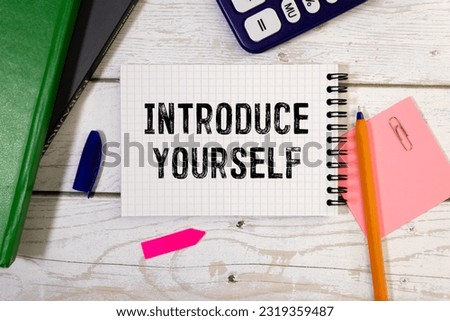 Sticky note with the text Introduce yourself on office desk. Self-introduction concept. Royalty-Free Stock Photo #2319359487