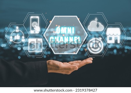 Omni channel concept, Person hand holding omni channel icon on virtual screen. Royalty-Free Stock Photo #2319378427
