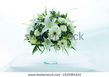Beautiful flowers in a vase on a white background. Very clear picture.