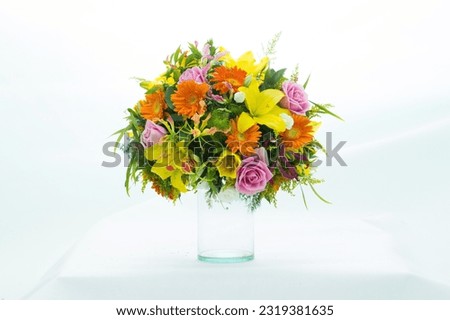 Beautiful flowers in a vase on a white background. Very clear picture.