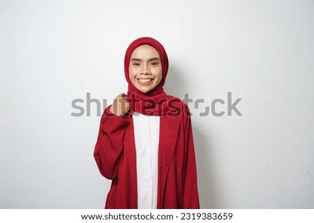 Asian business Muslim woman ini red casual smiling happy and looking confident