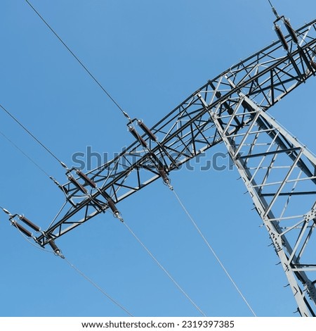  Power pole in Germany for conducting electricity over long distances                               Royalty-Free Stock Photo #2319397385
