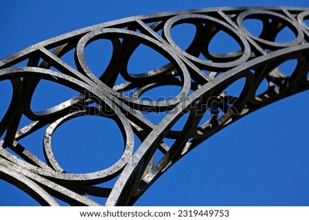part of a beautiful metal arch in the style of the twenties