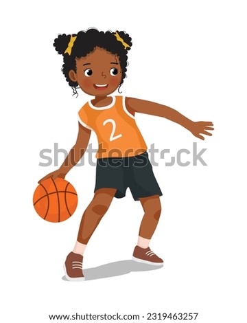 Cute little African girl with sportswear playing basketball dribbling the ball in action Royalty-Free Stock Photo #2319463257