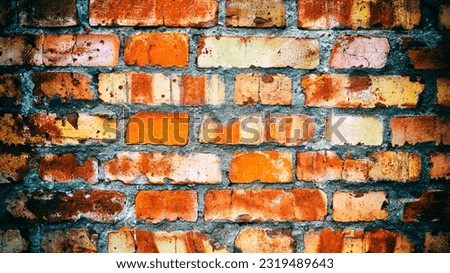 Close-up of an old red brick wall. Added vintage camera and vignetting effect