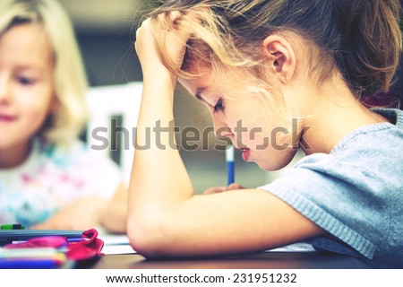 Siblings are doing his homework for elementary school. Royalty-Free Stock Photo #231951232