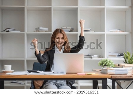 Excited female feeling euphoric celebrating online win success achievement result, young woman happy about good email news, motivated by great offer or new opportunity, passed exam, got a job Royalty-Free Stock Photo #2319516331