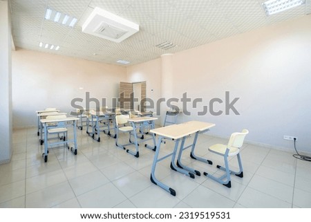 Classroom with modern desks and tables