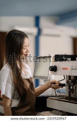 Young barista making coffee, coffee preparation service concept.