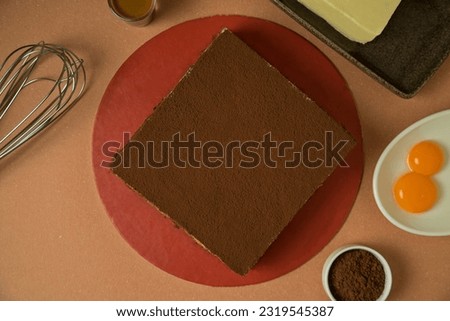 Tiramisu is a coffee-flavored Italian dessert. It is made of ladyfingers dipped in coffee, layered with a whipped mixture of eggs, sugar, and mascarpone cheese, flavored with cocoa.