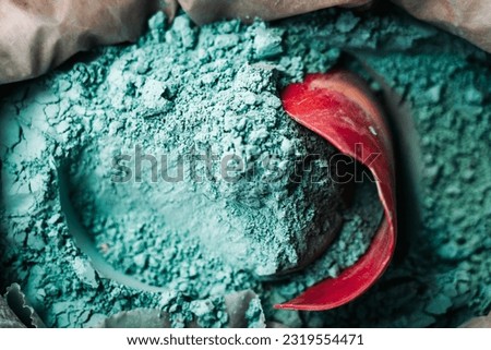 Colorful dusty sand bag: Bag of vibrant color light blue, colorful sand invite creative exploration and sensory delights.