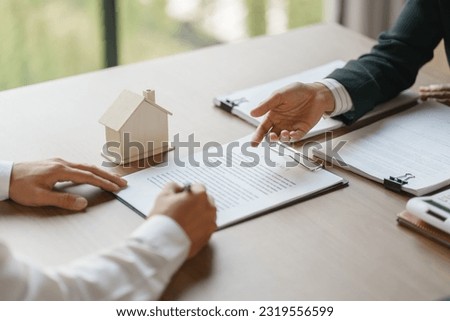 Approved stamp with Business people signing contract making deal with real estate consultant home insurance
Real estate investment Property insurance security offer house