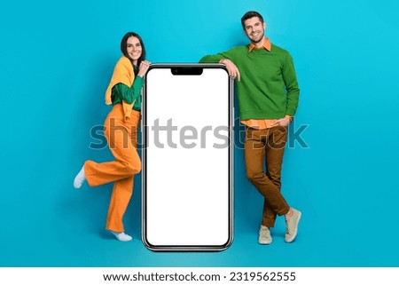 Full length photo of two people advertise smart board internet shopping smart gadgets isolated blue color background Royalty-Free Stock Photo #2319562555