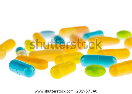 many tablets lying on a light background. photo icon for medicine and drugs the pharmaceutical industry