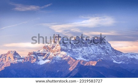 Sinrise or sunset panoramic banner view of the Dents du Midi in the Swiss Alps, canton Vaud, Switzerland Royalty-Free Stock Photo #2319583727