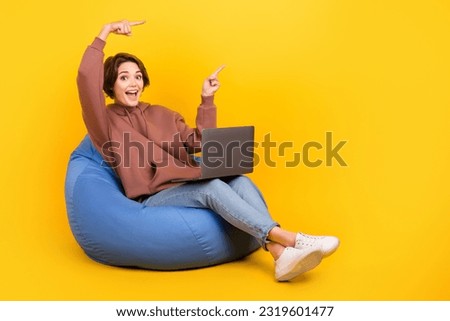 Full size photo of young girl wear brown pullover pointing fingers new event coworking zone with laptop isolated on yellow color background Royalty-Free Stock Photo #2319601477