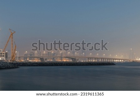 bridge over the sea in Abu dhabi during a humid evening