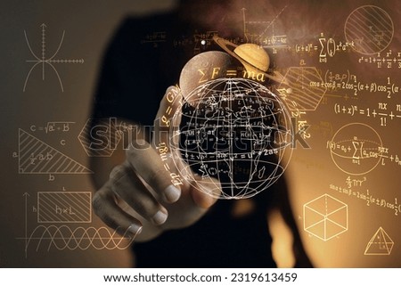 A student or physics scientist pointing at the planet saturn and globe to study laws of gravitational force that affect our planet and phenomena such as sea level or heat waves from solar storms. Royalty-Free Stock Photo #2319613459