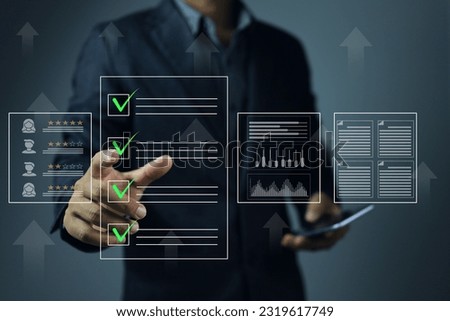 A businessman click green check mark to evaluating a vendor or supplier industrial facility and rated a maximum of five stars according to the ISO documentation management system Royalty-Free Stock Photo #2319617749