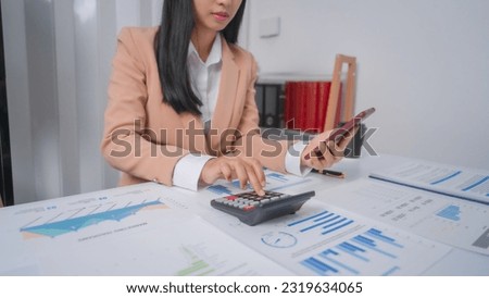 Excited Asian bookkeepers doing bookkeeping, accounts payable, assets, book value, equity, inventory, liabilities, cost of goods sold, depreciation, expenses, Gross profit, diversification, liquidity Royalty-Free Stock Photo #2319634065