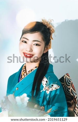 Portrait of young Asian girl wearing kimono. Japanese traditional ceremony dress.