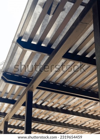 Metal sheet roof and black steel frame for the garage, stock photo
