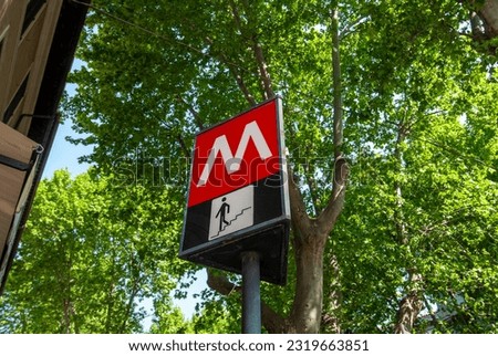Red and white Metro station sign in Rome Italy.