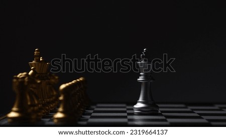 Chess Single king stand alone against many enemies as a symbol of difficult unequal fight or struggle of minorities confidence concept. Royalty-Free Stock Photo #2319664137