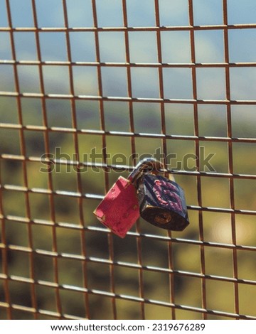 Love locks padlocks with the initials of two lovers, locked in a net. Love promise.
