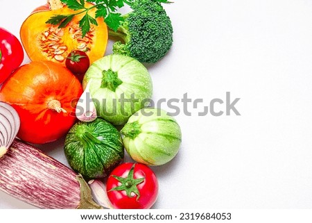 Fresh organic vegetables on a white background. Photo top view. The concept of a balanced diet. Copy space. Food photo.