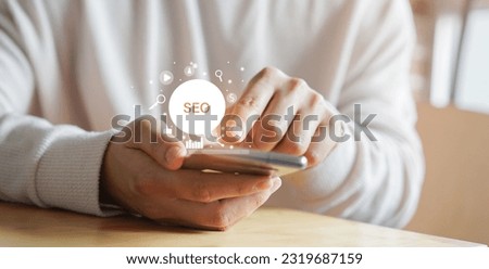 close up man hand use smartphone for search engine optimization (SEO) tools for finding customer or promote and advertise about content online for referral marketing technology and business concept