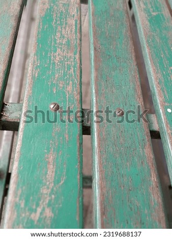 nail in the green wood chair Royalty-Free Stock Photo #2319688137