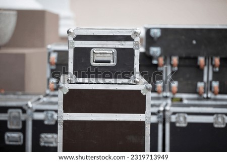 Case boxes for musical equipment. Professional stage equipment is packed in special boxes. Royalty-Free Stock Photo #2319713949