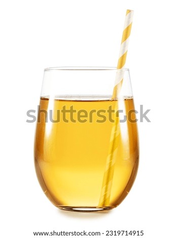 Studio shot of apple juice or lemon tea in a glass with paper drinking  straw isolated on white background. 