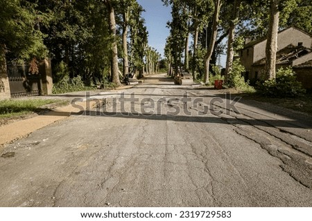 A photo capturing a broken road in Italy undergoing repair and maintenance work.
