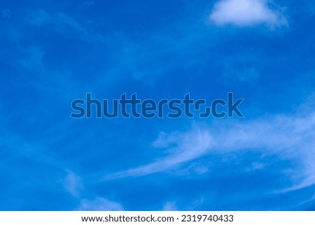 White clouds in the blue sky. Blue sky with white clouds. Conceptual photo: freedom, paradise, space, God's abode, blessing, grace. Sky background.