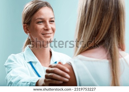 A blonde doctor and her blonde patient in a bond of trust. The doctor could be a gynecologist, psychiatrist, or family physician who attentively cares for both her patient's physical and emotional wel Royalty-Free Stock Photo #2319753227