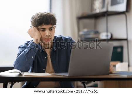Boring Job. Bored Arab Businessman Sitting At Laptop Working In Modern Office. Entrepreneurship And Business Problem, Boredom Issue At Workplace. Shot Of Uninterested Employee